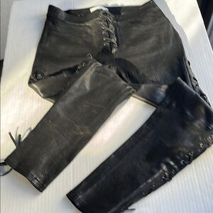 Frame Black Leather jeans with side zipper. Laced up the sides. Size 25